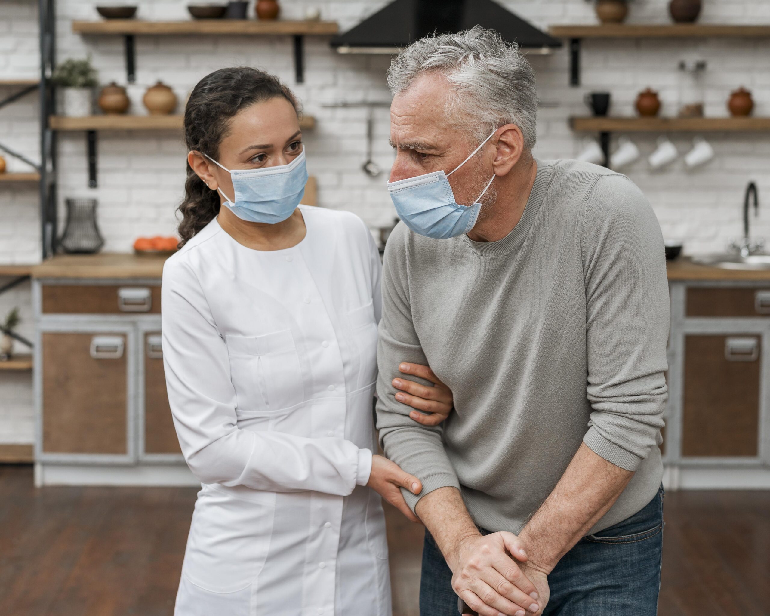 doctor-holding-patient-pain